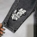 شلوار لی دخترانه مشکی طرح میکی موس مناسب 1 تا 12 سال