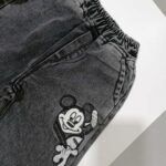 شلوار لی دخترانه مشکی طرح میکی موس مناسب 1 تا 12 سال