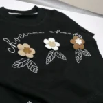 تیشرت شلوارک دخترانه مشکی گل برجسته مناسب 0 تا 5 سال