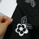 تیشرت شلوارک دخترانه مشکی گل برجسته مناسب 0 تا 5 سال