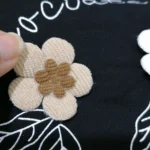 تیشرت شلوارک دخترانه مشکی گل برجسته مناسب 0 تا 5 سال