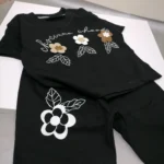 ست لباس دخترانه مشکی گل برجسته مناسب 0 تا 5 سال