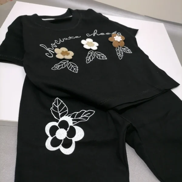 ست لباس دخترانه مشکی گل برجسته مناسب 0 تا 5 سال